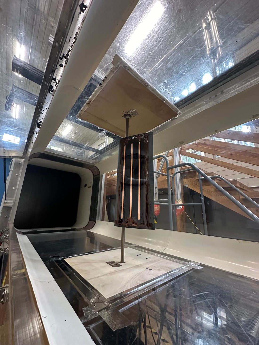 An instrumented airfoil test article mounted vertically in a wind-tunnel test section.