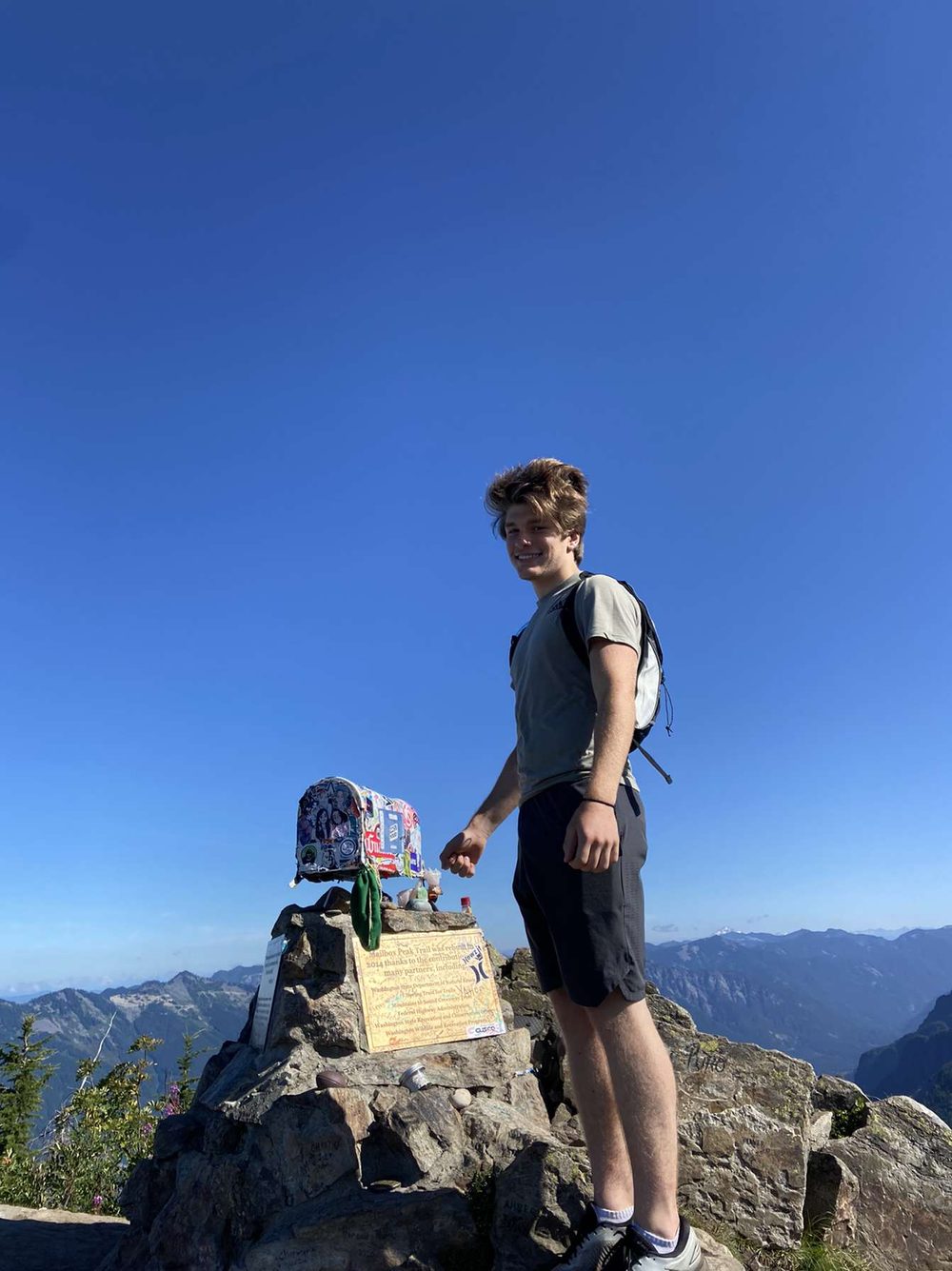 A hiker at the summit of Mailbox Peak in Washington.